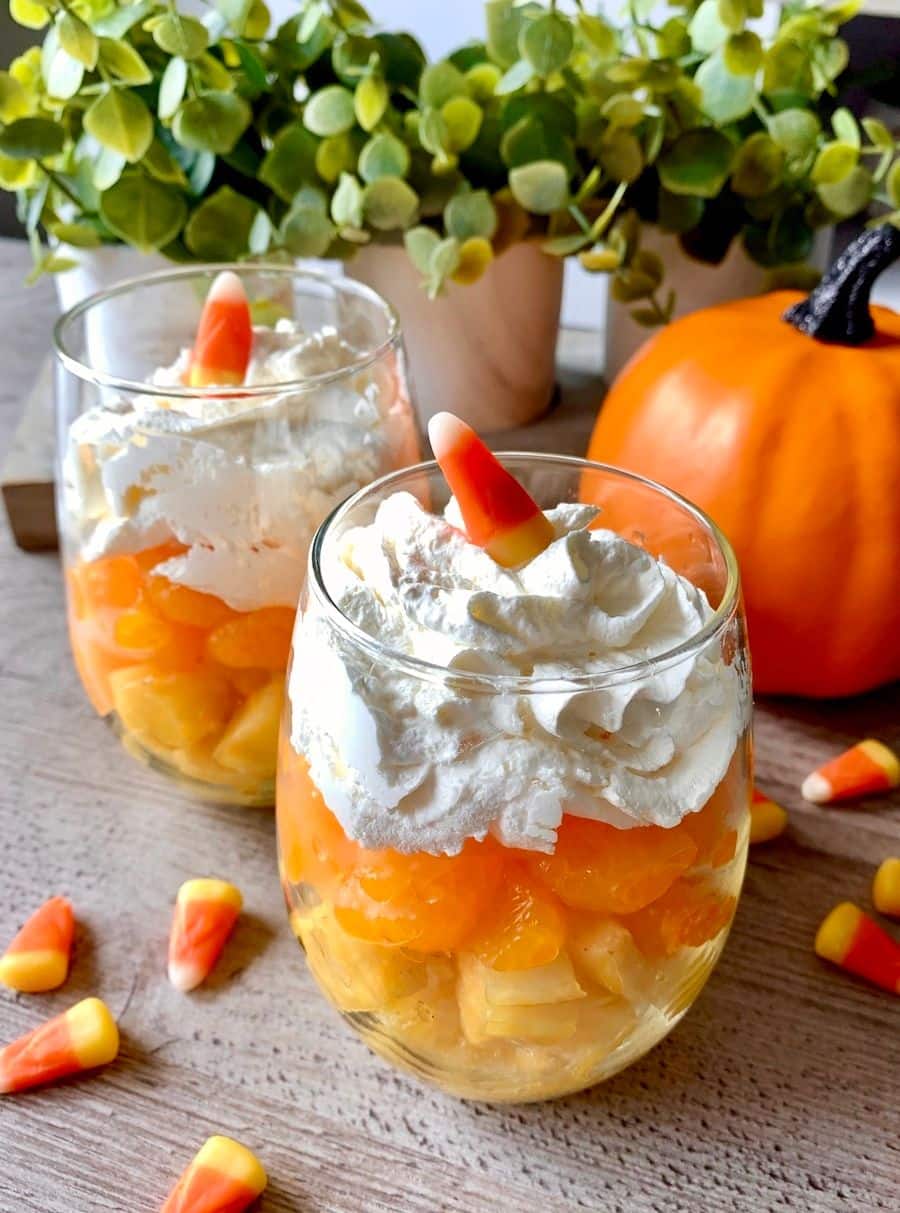 A healthy alternative to actual candy corn, this super simple Halloween party snack combines delicious fruit and whipped topping. 